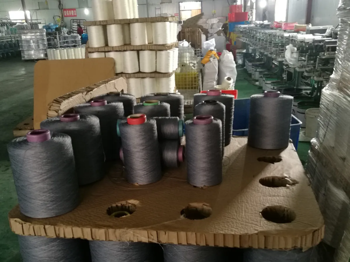 Grey yarn cones on a creel